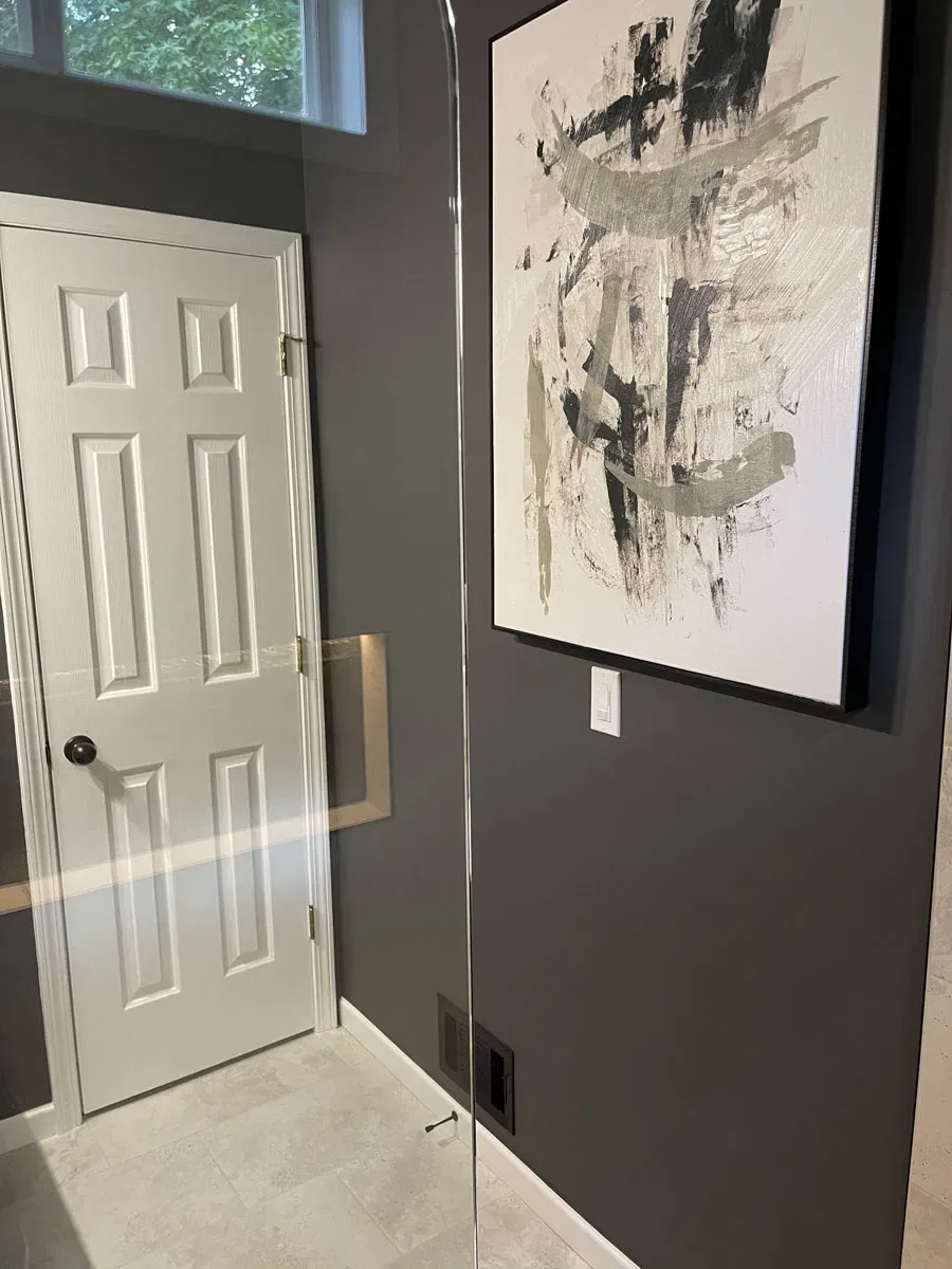 Modern hallway with abstract art and glass door